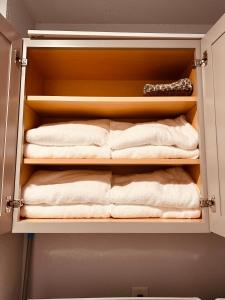 a closet with towels and a bunch of towels at New, Fun-Size Benbow House! in Garberville