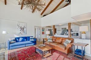 a living room with a couch and a table at Blue View Chalet in Blowing Rock