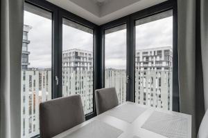 Posteľ alebo postele v izbe v ubytovaní Garden Towers