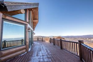 a wooden deck with a view of the mountains at Mansion In The Sky in Beech Mountain