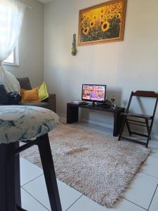 TV a/nebo společenská místnost v ubytování Duplex com dois Quartos