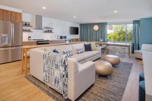 a living room with a couch and a kitchen at Element Atlanta Buckhead in Atlanta