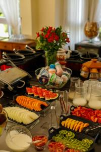 a table with many plates of food on it at Carballo Hotel & Spa in Campos do Jordão