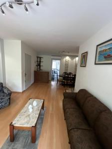 a living room with a couch and a coffee table at Apartamento en Pocitos in Montevideo