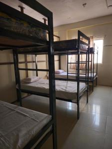 a group of bunk beds in a room at KSHIPRA GUEST HOUSE in Ujjain