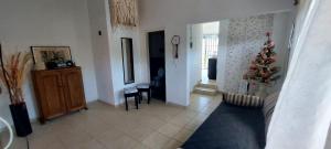 a living room with a christmas tree on the wall at Don Edelmi in Villa Carlos Paz