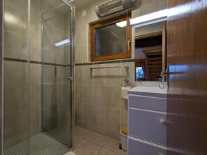 a bathroom with a shower and a sink at Chalet 3 étoiles avec sauna près de La Bresse - FR-1-589-18 in Basse-sur-le-Rupt +27 photos