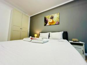 En eller flere senge i et værelse på Zen Central Studio