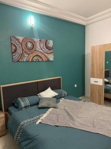 En eller flere senge i et værelse på Appartement luxueux cosy - quartier prisé Virage