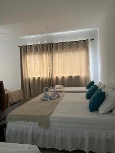 Postel nebo postele na pokoji v ubytování Pousada Recanto dos Pássaros - Arraial d'Ajuda