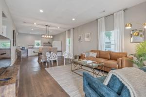 a living room with a couch and a table at BOHO Bungalow in Tulsa