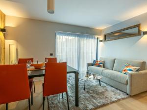 a living room with a couch and a table at Appartement Val-d'Isère, 3 pièces, 4 personnes - FR-1-694-347 in Val-d'Isère