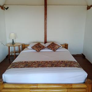 Postel nebo postele na pokoji v ubytování Bali jungle cabin