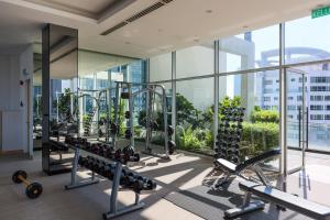 a gym with cardio equipment in a building at 188 Suites KLCC By Bliss Home At City Centre in Kuala Lumpur