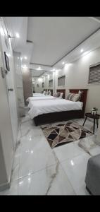 a large white bedroom with a large bed in it at Oceanic,unit 124 ocean view in Durban