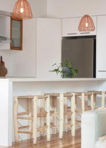 a kitchen with white cabinets and a white counter top at Worrowing Jervis Bay in Huskisson
