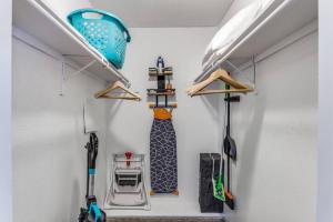 a room with two hangers and a skateboard on a wall at Medical District_Fast Wi-fi in Dallas