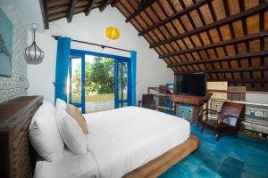 Giường trong phòng chung tại Loft House 2BR Beachside An Bang Beach Hoi An by Beachside Boutique Homes