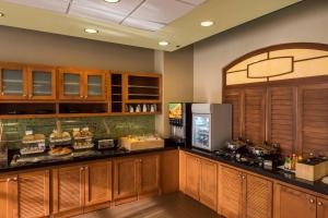 a kitchen with a counter with food on it at SpringHill Suites by Marriott Birmingham Downtown at UAB in Birmingham