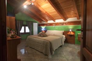 Postel nebo postele na pokoji v ubytování b&b Al Castel