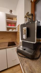 a laptop computer sitting on a counter in a kitchen at Ferienwohnung Bergblume in Bolsterlang