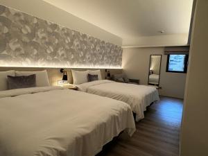 Ένα ή περισσότερα κρεβάτια σε δωμάτιο στο Delight Hotel