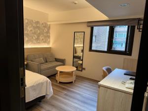 Ένα ή περισσότερα κρεβάτια σε δωμάτιο στο Delight Hotel