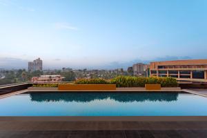 a swimming pool on the roof of a building at Kochi Marriott Hotel in Cochin