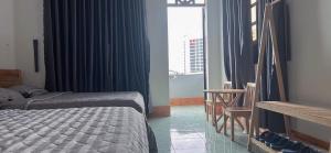 Postel nebo postele na pokoji v ubytování Hotel Minh Vy