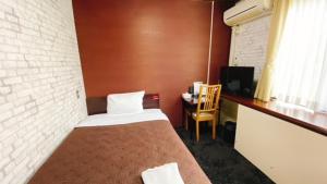 Postel nebo postele na pokoji v ubytování Hotel Select Inn Tsuyama