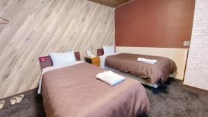 Postel nebo postele na pokoji v ubytování Hotel Select Inn Tsuyama