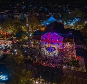 an aerial view of a festival at night at Elati Mansion in Elati
