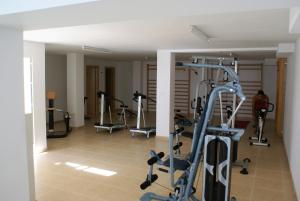 a gym with several tread machines in a room at SUNNY SEA VIEW in Alicante