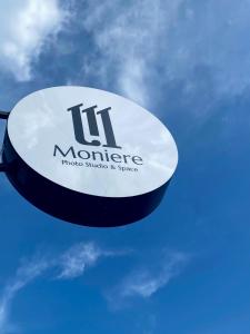 a sign that reads its mortgage on a blue sky at Moniere House in Kasri