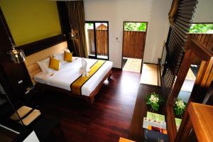 Postel nebo postele na pokoji v ubytování Peach Hill Resort - SHA Extra Plus