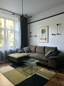 a living room with a couch and a table at Composition No. 2 in Krakow