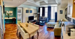 a living room with a couch and a table at Cartwrights in Cape Town