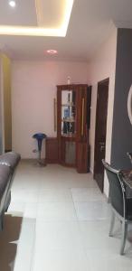 a living room with a couch and a cabinet at Gradun in Ikeja