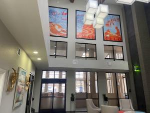 a lobby with windows and a ceiling with artwork at Quality Inn West Medical Center in Amarillo