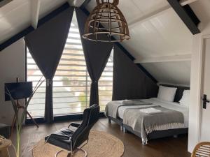 En eller flere senger på et rom på Villa Zandvoort