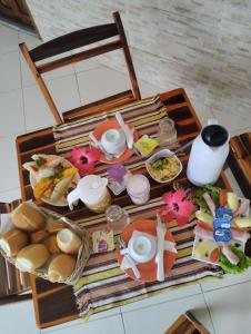 a table with a tray of food on a table at Manitu Flat Canoa Quebrada in Canoa Quebrada