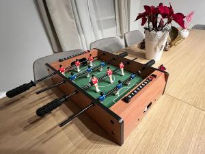 a coffee table with a soccer game on it at Holiday 33 Apartment K next to Alexanderplatz in Berlin