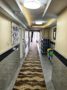a hallway with a long aisle in a hospital at Hotel Seref in Yalova