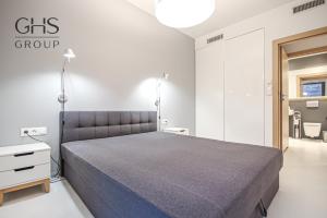 Postel nebo postele na pokoji v ubytování Ekskluzywny Apartament obok Zamku Wawelskiego