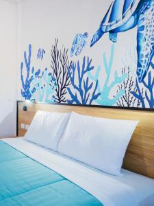 Ένα ή περισσότερα κρεβάτια σε δωμάτιο στο Touch Sea Boutique Hotel&Bistro