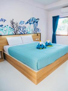 Un pat sau paturi într-o cameră la Touch Sea Boutique Hotel&Bistro