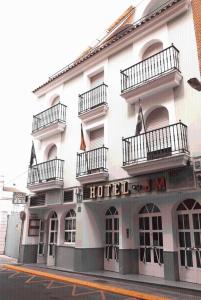 a hotel on the corner of a street at Hotel El Emigrante in Villanueva de la Serena