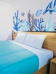 Ένα ή περισσότερα κρεβάτια σε δωμάτιο στο Touch Sea Boutique Hotel&Bistro