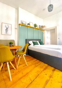 Postel nebo postele na pokoji v ubytování Fachwerkträume - 35m² Weltkulturerbe