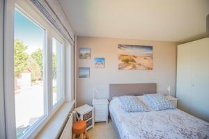 Postel nebo postele na pokoji v ubytování B&B De Kleine Prins